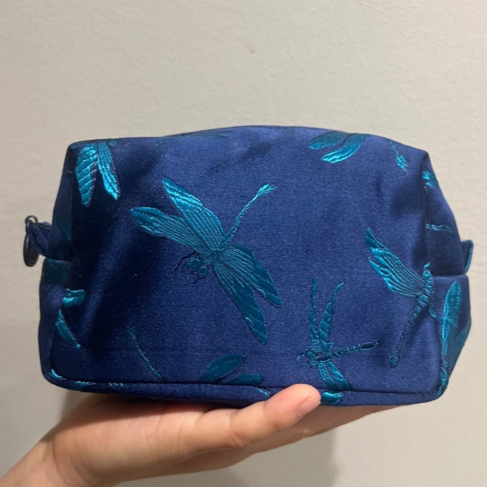 Embroidered silk clutch with dragonfly graphic
